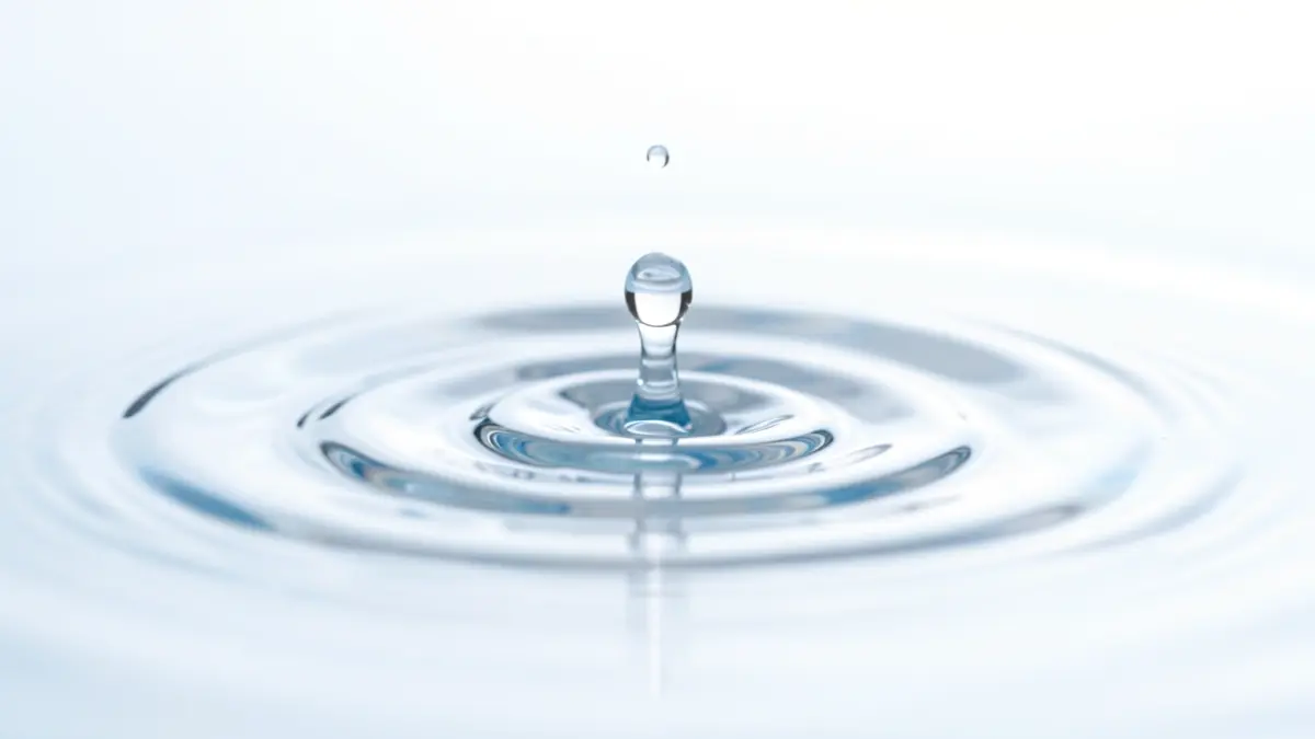 Generic image of a water droplet falling into clear water, creating ripples.